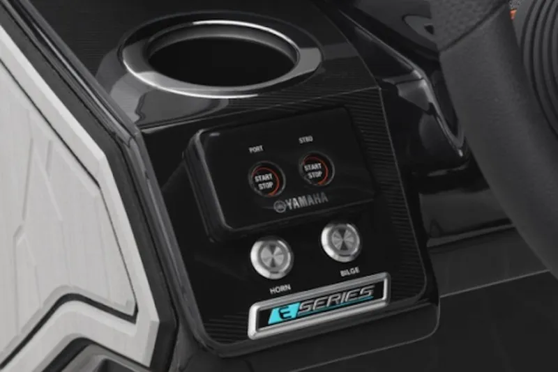 Slide: The Image of 2025 Yamaha Boats 252XE dashboard with start/stop buttons and cup holder. - 54