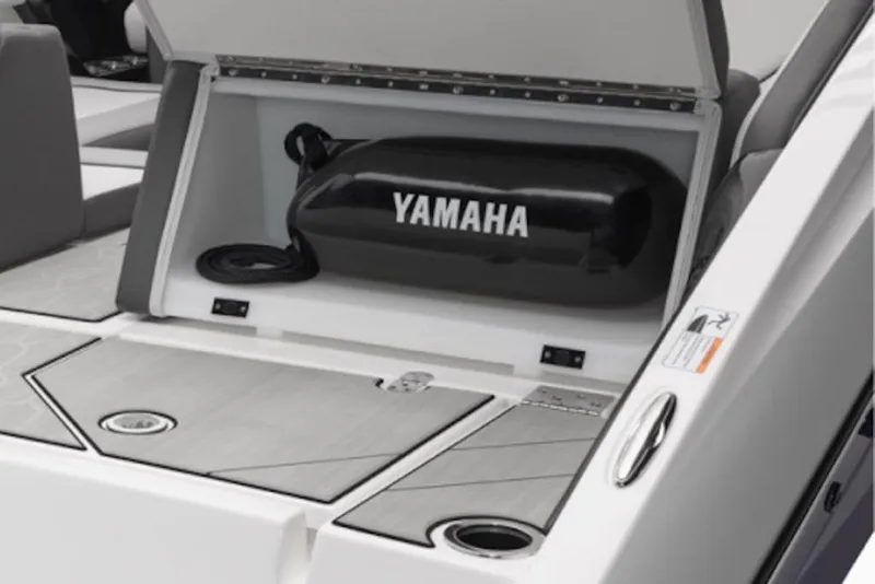Slide: The Image of 2025 Yamaha Boats 252XE storage compartment with Yamaha-branded equipment. - 56