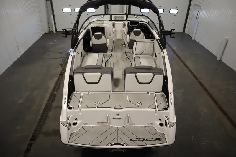 Slide: The Image of 2025 Yamaha Boats 252XE interior view, showcasing spacious seating and modern design. - 9