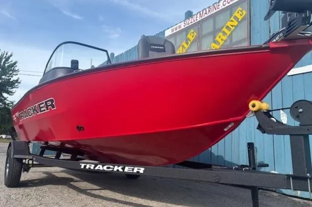 Slide: The Image of 2026 Tracker Pro Guide V-16 WT boat in vibrant red on a trailer. - 2