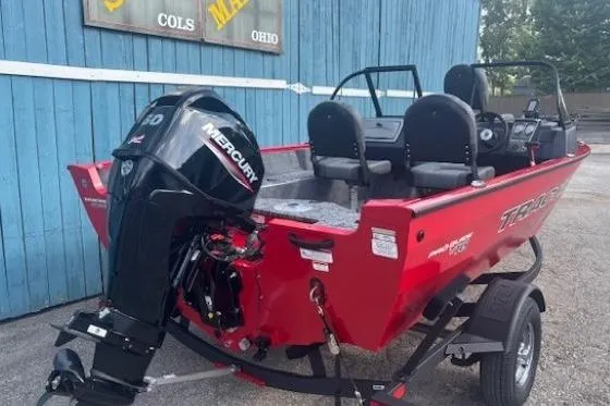Slide: The Image of 2026 Tracker Pro Guide V-16 WT boat with Mercury engine, parked on trailer. - 3