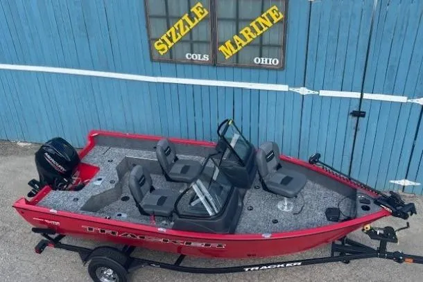 Slide: The Image of 2026 Tracker Pro Guide V-16 WT boat, red, parked at Sizzle Marine, Ohio. - 6