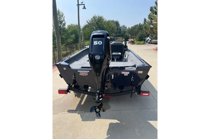 Slide: The Image of 2026 Tracker Super Guide V-16 SC boat with Mercury 50 engine, parked outdoors. - 3
