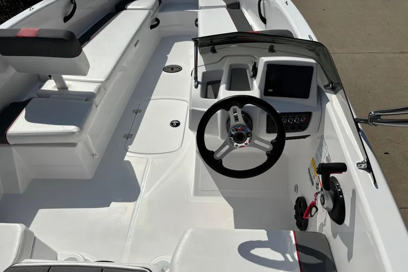 Slide: The Image of 2026 Tahoe T18 boat interior with steering wheel and seating. - 5