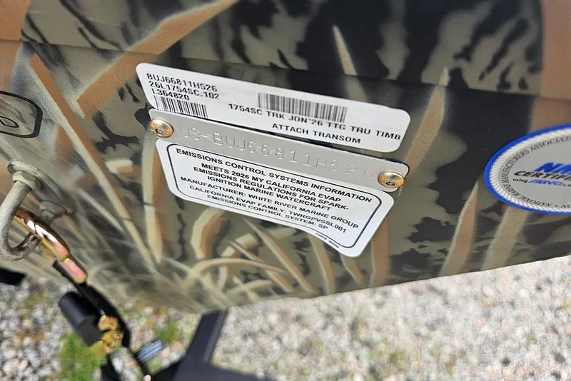 Slide: The Image of 2026 Tracker Grizzly 1754 SC boat with emissions control information and certification labels. - 18