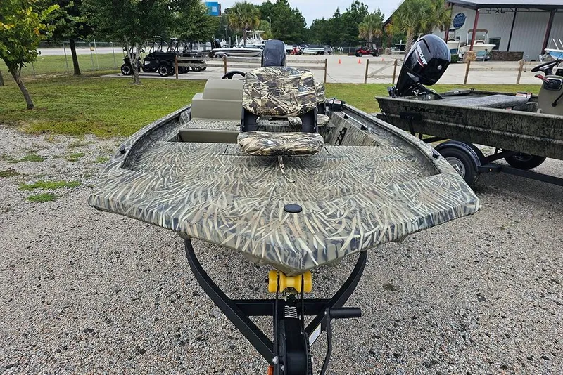 Slide: The Image of 2026 Tracker Grizzly 1754 SC boat with camouflage design on a trailer. - 4
