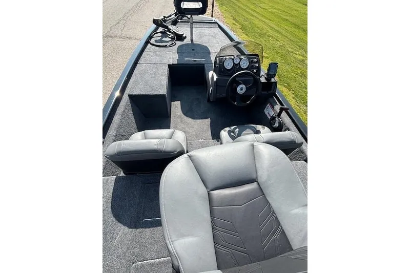 Slide: The Image of 2026 Tracker Pro 170 boat interior with steering console and seating. - 3