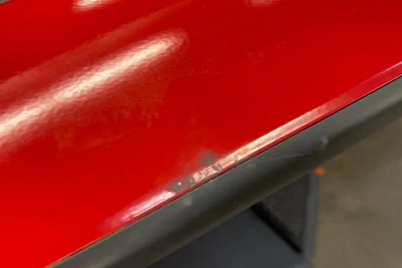 Slide: The Image of Close-up of red Tracker Pro Team 175 boat, 2026 model, showing glossy finish. - 67