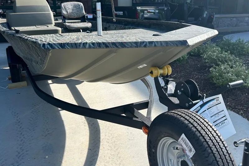 Slide: The Image of 2026 Tracker Grizzly 1754 SC boat on trailer, showcasing rugged design and durable construction. - 2