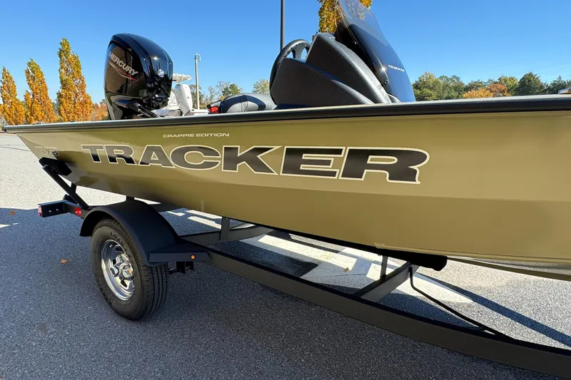 Slide: The Image of 2026 Tracker Pro Team 175 Crappie Edition boat on trailer, outdoor setting. - 7