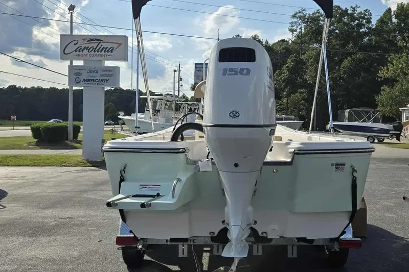 Slide: The Image of 2026 Sundance DX22 boat with 150 HP engine at Carolina Boat Company. - 9