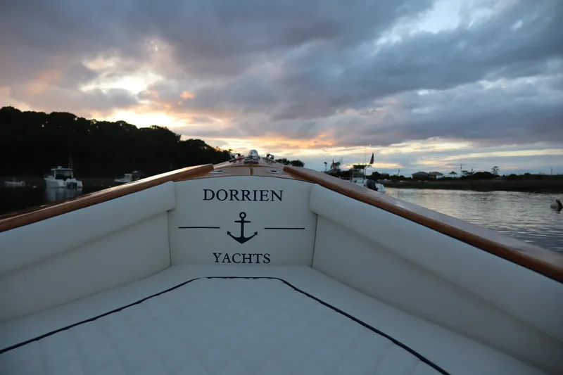 Slide: The Image of Luxury Dorrien Yachts 160T 1/1, 2025 model, at sunset on tranquil waters. - 12