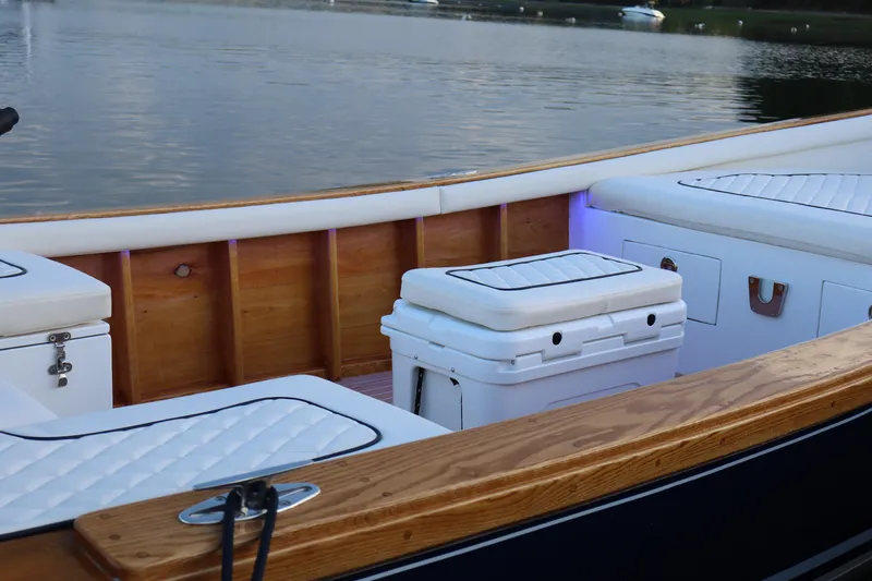 Slide: The Image of Luxurious 2025 DORRIEN YACHTS 160T interior with cushioned seating and wooden accents. - 14