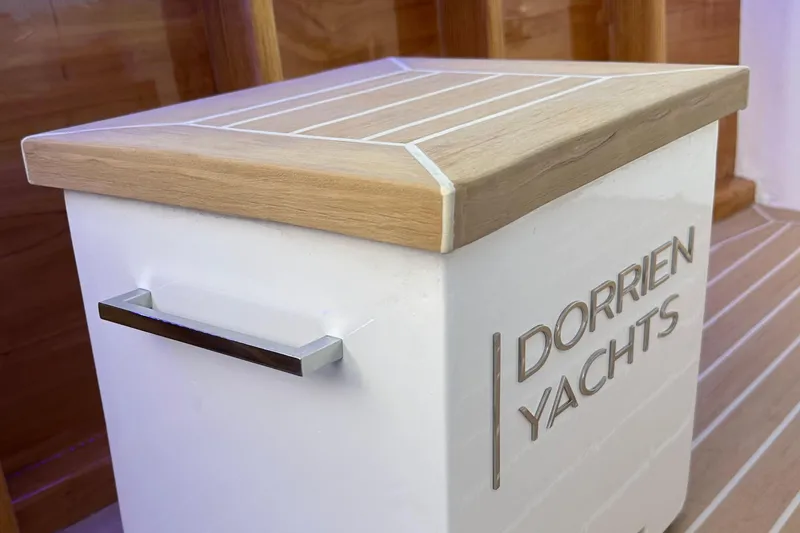Slide: The Image of Luxury yacht detail with DORRIEN YACHTS branding, featuring sleek design and wooden accents, 2025 model. - 16