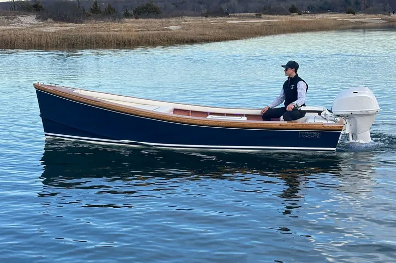 Slide: The Image of 2025 DORRIEN YACHTS 160T 1/1 boat on calm water, featuring sleek design. - 2