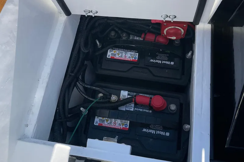 Slide: The Image of Battery compartment of 2025 DORRIEN YACHTS 160T 1/1, featuring West Marine batteries. - 22