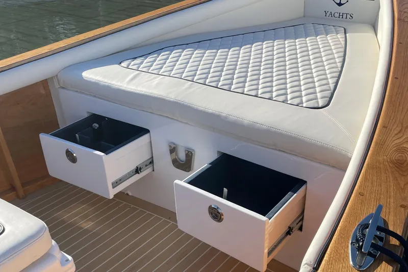 Slide: The Image of Luxurious DORRIEN YACHTS 160T 1/1, 2025 model, featuring elegant seating and storage drawers. - 13