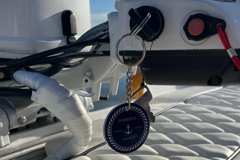 Slide: The Image of Keychain with Dorrien Yachts logo on a 2025 yacht control panel. - 24