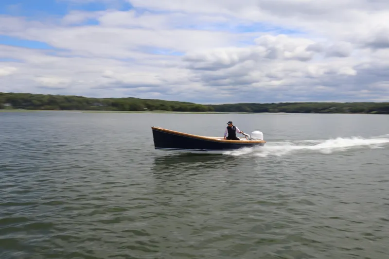 Slide: The Image of 2025 DORRIEN YACHTS 160T 1/1 cruising on a serene lake under cloudy skies. - 26