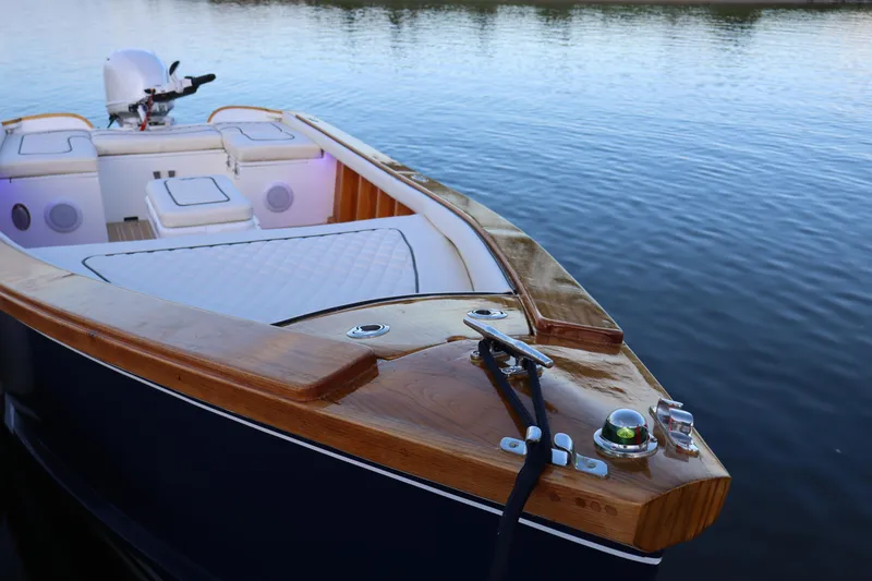 Slide: The Image of Luxurious 2025 Dorrien Yachts 160T boat with elegant wood finish on calm water. - 4