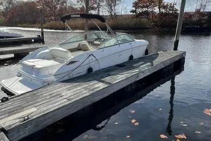 Slide: The Image of 2008 Cobalt 252 boat docked on calm water with autumn leaves. - 2