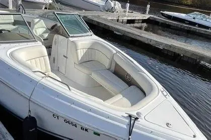 Slide: The Image of 2008 Cobalt 252 boat docked, featuring white seating and sleek design. - 3