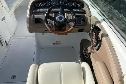Slide: The Image of 2008 Cobalt 252 boat cockpit with steering wheel and control panel. - 5