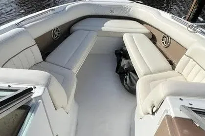 Slide: The Image of 2008 Cobalt 252 boat interior with white and beige seating, spacious layout. - 6