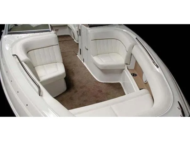 Slide: The Image of 2008 Cobalt 252 boat interior with white seating and carpeted floor. - 8