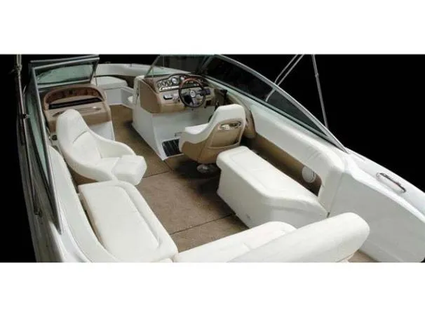 Slide: The Image of Interior of a 2008 Cobalt 252 boat with white and beige seating. - 9
