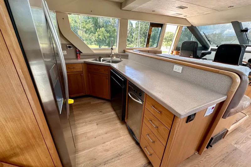 Slide: The Image of Interior of 2000 Pacific Mariner 65 Motoryacht with modern kitchen and helm station. - 11
