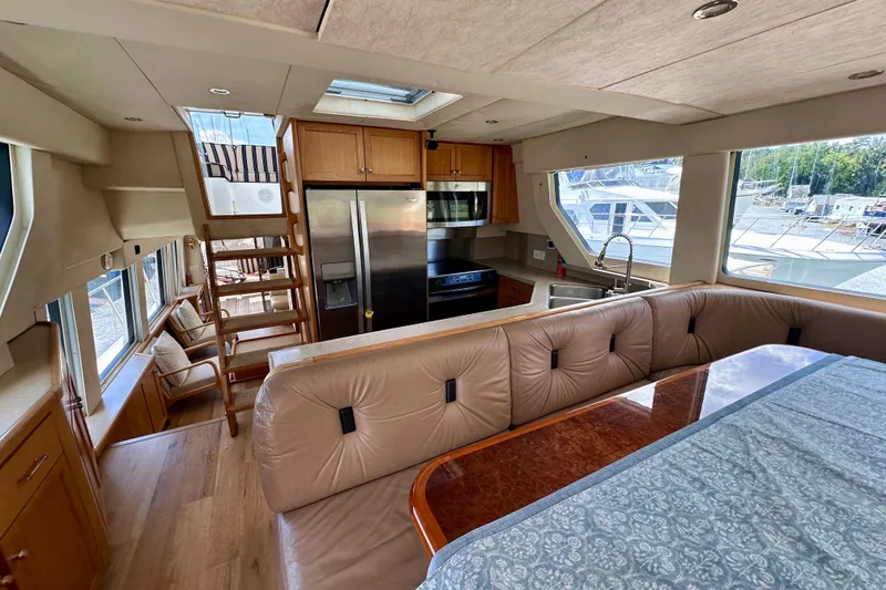 Slide: The Image of Kitchen interior of 2000 Pacific Mariner 65 Motoryacht with stainless steel appliances. - 13
