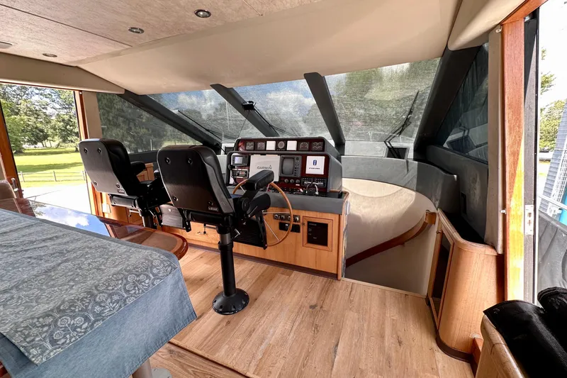 Slide: The Image of Luxurious interior of 2000 Pacific Mariner 65 Motoryacht with leather seating and modern kitchen. - 15