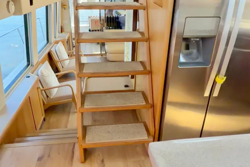 Slide: The Image of Bathroom interior of 2000 Pacific Mariner 65 Motoryacht with floral wallpaper and modern fixtures. - 31