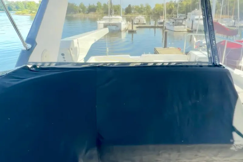 Slide: The Image of 2000 Pacific Mariner 65 Motoryacht interior with blue seating and speaker. - 34