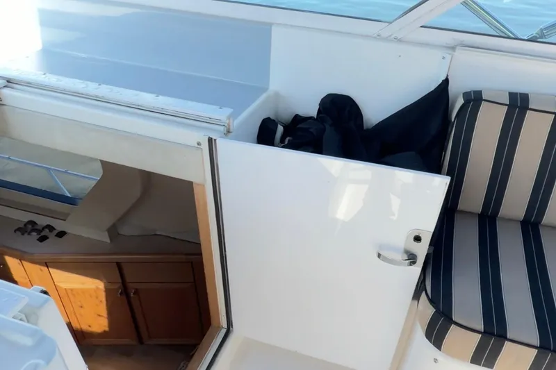 Slide: The Image of 2000 Pacific Mariner 65 Motoryacht deck view with lush greenery in the background. - 36