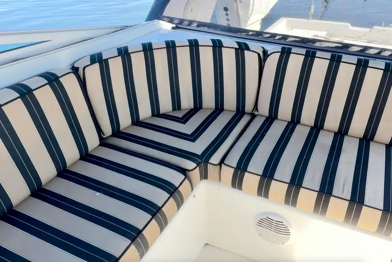Slide: The Image of Interior view of 2000 Pacific Mariner 65 Motoryacht with striped seating and wooden cabinets. - 37
