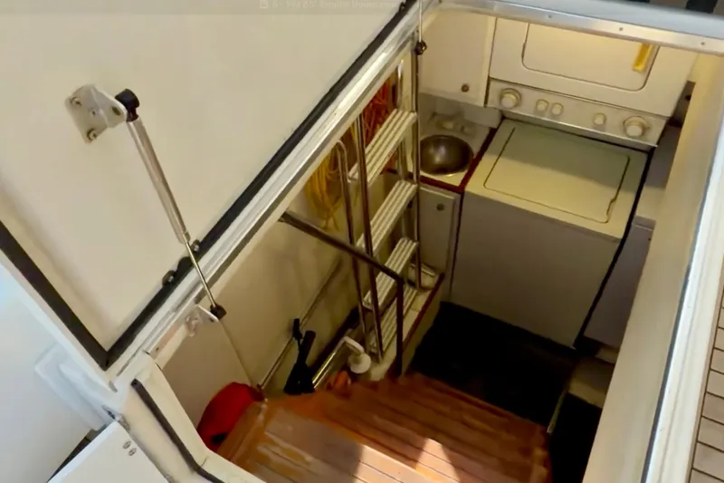 Slide: The Image of 2000 Pacific Mariner 65 Motoryacht deck with open storage compartment and humorous text. - 42