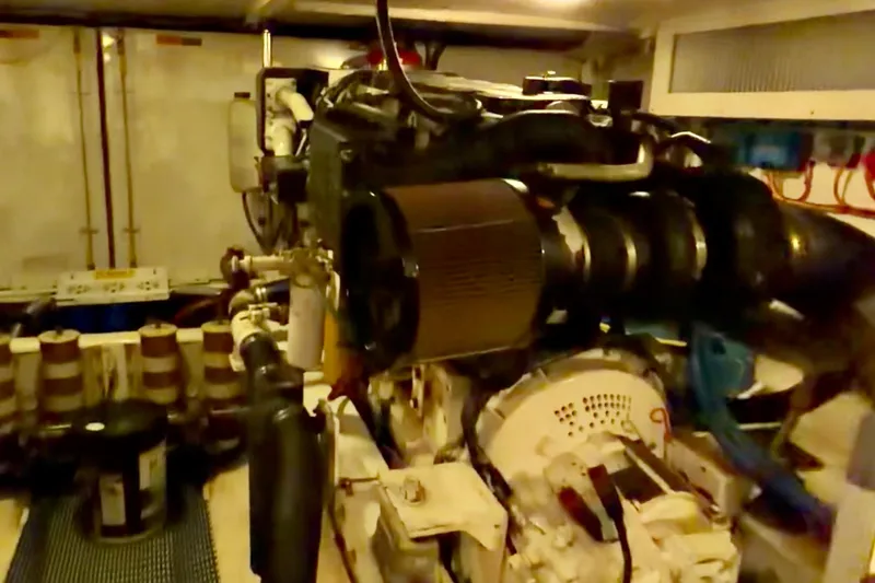 Slide: The Image of Engine room of a 2000 Pacific Mariner 65 Motoryacht, showcasing machinery and equipment. - 45
