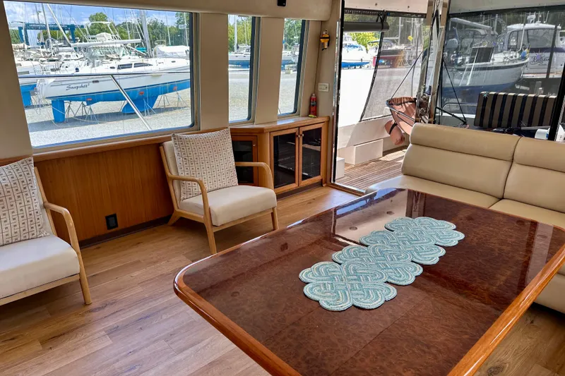 Slide: The Image of Luxurious interior of 2000 Pacific Mariner 65 Motoryacht with modern decor and pineapple artwork. - 5