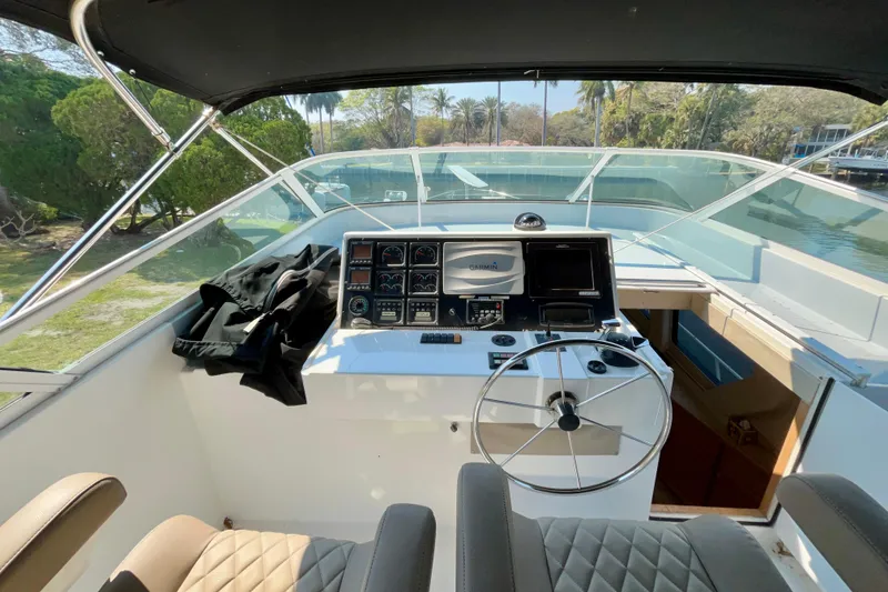 Slide: The Image of Helm of 2000 Pacific Mariner 65 Motoryacht with steering wheel and navigation equipment. - 53