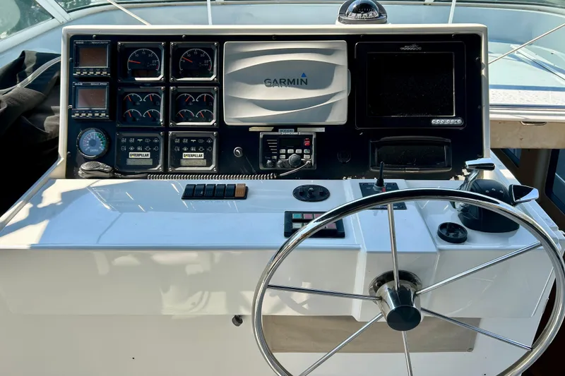 Slide: The Image of Control panel of a 2000 Pacific Mariner 65 Motoryacht with Garmin navigation system. - 54
