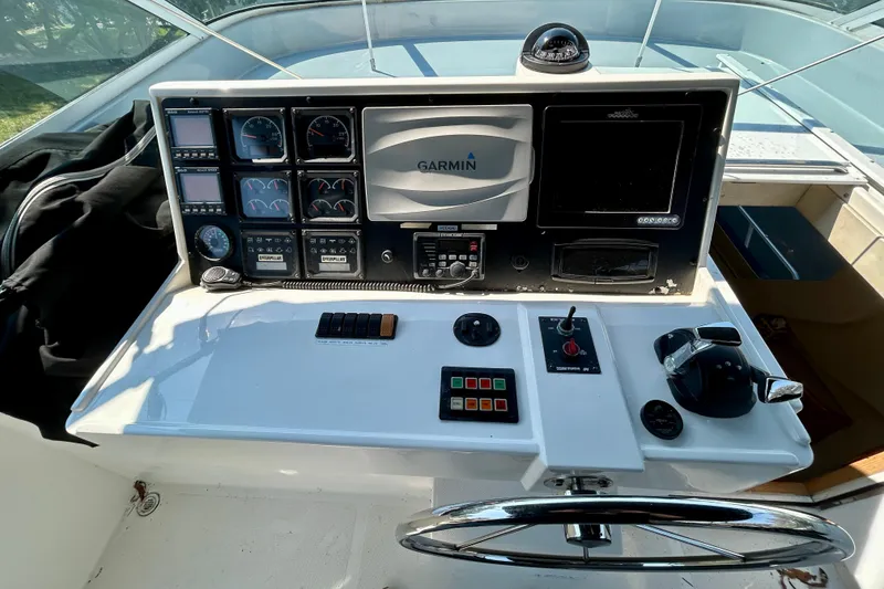 Slide: The Image of Control panel of a 2000 Pacific Mariner 65 Motoryacht with Garmin navigation system. - 55