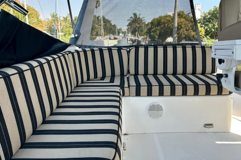 Slide: The Image of Striped seating area on a 2000 Pacific Mariner 65 Motoryacht, with scenic outdoor view. - 61