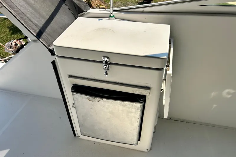 Slide: The Image of Storage compartment on 2000 Pacific Mariner 65 Motoryacht deck, featuring a secure latch. - 64