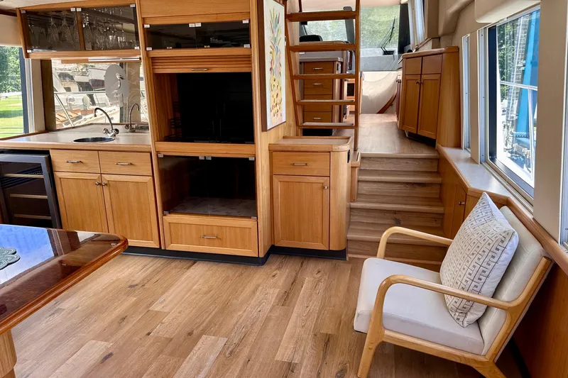 Slide: The Image of Interior of 2000 Pacific Mariner 65 Motoryacht with wooden cabinetry and seating. - 7