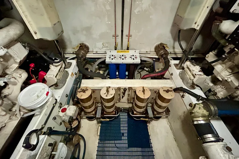 Slide: The Image of Engine room of 2000 Pacific Mariner 65 Motoryacht, showcasing mechanical components and systems. - 77