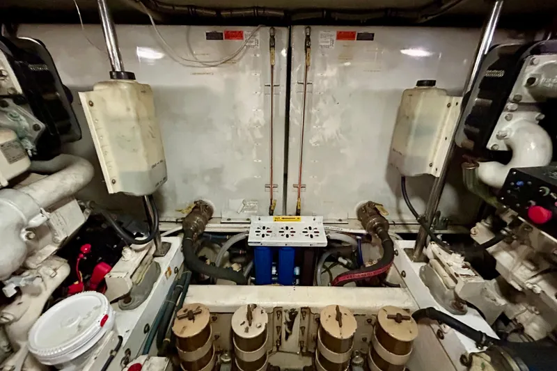 Slide: The Image of Engine room of a 2000 Pacific Mariner 65 Motoryacht, showcasing mechanical components. - 78
