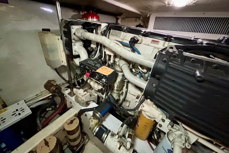 Slide: The Image of Engine room of a 2000 Pacific Mariner 65 Motoryacht, showcasing mechanical components. - 79