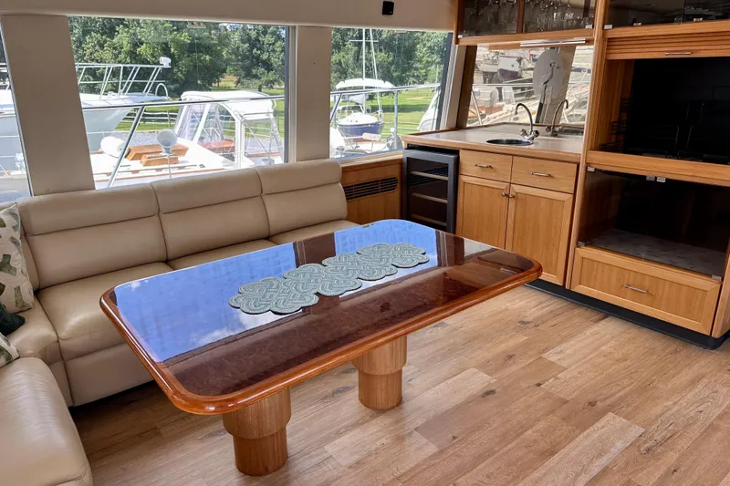 Slide: The Image of Interior of 2000 Pacific Mariner 65 Motoryacht with wooden cabinetry and seating. - 8